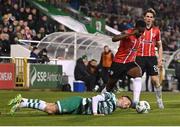 3 March 2023; Sadou Diallo of Derry City in action against Dylan Watts of Shamrock Rovers during the SSE Airtricity Men's Premier Division match between Shamrock Rovers and Derry City at Tallaght Stadium in Dublin. Photo by Seb Daly/Sportsfile
