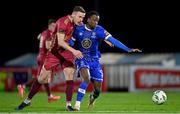 3 March 2023; Roland Idowu of Waterford in action against Killian Brouder of Galway United during the SSE Airtricity Men's First Division match between Waterford and Galway United at RSC in Waterford. Photo by Stephen Marken/Sportsfile