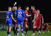 3 March 2023; Giles Phillips of Waterford is shown a yellow card by referee Alan Patchell during the SSE Airtricity Men's First Division match between Waterford and Galway United at RSC in Waterford. Photo by Stephen Marken/Sportsfile