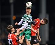 3 March 2023; Dylan Watts of Shamrock Rovers in action against Ollie O'Neill, left, and Will Patching of Derry City during the SSE Airtricity Men's Premier Division match between Shamrock Rovers and Derry City at Tallaght Stadium in Dublin. Photo by Seb Daly/Sportsfile