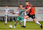 3 March 2023; Shane McEleney of Derry City in action against Graham Burke of Shamrock Rovers during the SSE Airtricity Men's Premier Division match between Shamrock Rovers and Derry City at Tallaght Stadium in Dublin. Photo by Seb Daly/Sportsfile