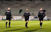 3 March 2023; Match officials, from left, Allen Lynch, Neil Doyle and Emmett Dynan warm-up before the SSE Airtricity Men's Premier Division match between Shamrock Rovers and Derry City at Tallaght Stadium in Dublin. Photo by Seb Daly/Sportsfile