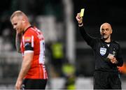 3 March 2023; Referee Neil Doyle shows a yellow card to Mark Connolly of Derry City during the SSE Airtricity Men's Premier Division match between Shamrock Rovers and Derry City at Tallaght Stadium in Dublin. Photo by Stephen McCarthy/Sportsfile