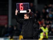 3 March 2023; Fourth official Rob Harvey holds up the board showing an additional six minutes of injury time during the SSE Airtricity Men's Premier Division match between Shamrock Rovers and Derry City at Tallaght Stadium in Dublin. Photo by Stephen McCarthy/Sportsfile
