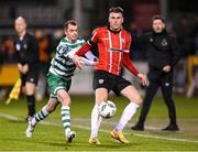 3 March 2023; Ryan Graydon of Derry City in action against Sean Kavanagh of Shamrock Rovers during the SSE Airtricity Men's Premier Division match between Shamrock Rovers and Derry City at Tallaght Stadium in Dublin. Photo by Stephen McCarthy/Sportsfile