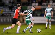 3 March 2023; Jack Byrne of Shamrock Rovers in action against Ollie O'Neill of Derry City during the SSE Airtricity Men's Premier Division match between Shamrock Rovers and Derry City at Tallaght Stadium in Dublin. Photo by Stephen McCarthy/Sportsfile