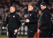 3 March 2023; Derry City first team coach Conor Loughrey, centre, with assistant manager Alan Reynolds, left, and manager Ruaidhrí Higgins, right, during the SSE Airtricity Men's Premier Division match between Shamrock Rovers and Derry City at Tallaght Stadium in Dublin. Photo by Stephen McCarthy/Sportsfile