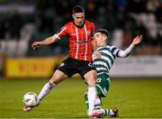 3 March 2023; Jordan McEneff of Derry City is tackled by Trevor Clarke of Shamrock Rovers during the SSE Airtricity Men's Premier Division match between Shamrock Rovers and Derry City at Tallaght Stadium in Dublin. Photo by Stephen McCarthy/Sportsfile