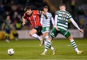 3 March 2023; Patrick McEleney of Derry City in action against Markus Poom of Shamrock Rovers during the SSE Airtricity Men's Premier Division match between Shamrock Rovers and Derry City at Tallaght Stadium in Dublin. Photo by Stephen McCarthy/Sportsfile