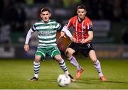 3 March 2023; Trevor Clarke of Shamrock Rovers in action against Ciaran Coll of Derry City during the SSE Airtricity Men's Premier Division match between Shamrock Rovers and Derry City at Tallaght Stadium in Dublin. Photo by Stephen McCarthy/Sportsfile