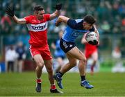 4 March 2023; David Byrne of Dublin in action against Benny Heron of Derry during the Allianz Football League Division 2 match between Derry and Dublin at Celtic Park in Derry. Photo by Ramsey Cardy/Sportsfile