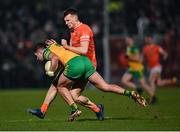 4 March 2023; Rían O'Neill of Armagh in action against Brendan McCole of Donegal during the Allianz Football League Division 1 match between Armagh and Donegal at Box-It Athletic Grounds in Armagh. Photo by Piaras Ó Mídheach/Sportsfile