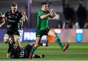 4 March 2023; Tom Farrell of Connacht evades the tackle of Will Reed of Dragons during the United Rugby Championship match between Dragons and Connacht at Rodney Parade in Newport, Wales. Photo by Chris Fairweather/Sportsfile