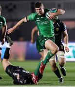 4 March 2023; Tom Farrell of Connacht evades the tackle of Will Reed of Dragons during the United Rugby Championship match between Dragons and Connacht at Rodney Parade in Newport, Wales. Photo by Chris Fairweather/Sportsfile