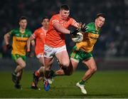 4 March 2023; Tiarnan Kelly of Armagh in action against Peader Mogan of Donegal during the Allianz Football League Division 1 match between Armagh and Donegal at Box-It Athletic Grounds in Armagh. Photo by Piaras Ó Mídheach/Sportsfile