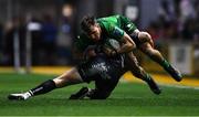 4 March 2023; John Porch of Connacht is tackled by Angus O'Brien of Dragons during the United Rugby Championship match between Dragons and Connacht at Rodney Parade in Newport, Wales. Photo by Ben Evans/Sportsfile