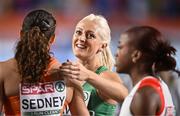 5 March 2023; Sarah Lavin of Ireland, centre, and Zoë Sedney of Netherlands, left, after qualifying for the women's 60m hurdles final during Day 3 of the European Indoor Athletics Championships at Ataköy Athletics Arena in Istanbul, Türkiye. Photo by Sam Barnes/Sportsfile
