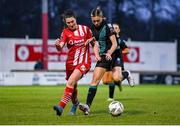 4 March 2023; Abbie Larkin of Shamrock Rovers in action against Lauren Boles of Sligo Rovers during the SSE Airtricity Women's Premier Division match between Sligo Rovers and Shamrock Rovers at The Showgrounds in Sligo. Photo by Seb Daly/Sportsfile