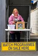 5 March 2023; Programme seller Aisling Collins from Corofin, Clare, studies the programme before the Allianz Football League Division 2 match between Clare and Cork at Cusack Park in Ennis, Clare. Photo by Eóin Noonan/Sportsfile