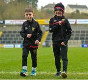 5 March 2023; Ruadhrí Watson, aged 7, from Castlewellan and Down manager Conor Laverty's son, Conlaoch Laverty, aged 8, from Kilcoo before the Allianz Football League Division 3 match between Cavan and Down at Kingspan Breffni in Cavan. Photo by Stephen Marken/Sportsfile