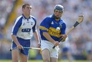 6 June 2004; Eoin Kelly, Tipperary, in action against Brian Phelan, Waterford. Guinness Munster Senior Hurling Championship semi-final, Tipperary v Waterford, Pairc Ui Chaoimh, Cork. Picture credit; Brendan Moran / SPORTSFILE