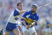 6 June 2004; Eoin Kelly, Tipperary, in action against Brian Phelan, Waterford. Guinness Munster Senior Hurling Championship semi-final, Tipperary v Waterford, Pairc Ui Chaoimh, Cork. Picture credit; Brendan Moran / SPORTSFILE