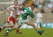 6 June 2004; Mark Little, Fermanagh, in action against Ciaran Gourley, Tyrone. Bank of Ireland Ulster Senior Football Championship, Tyrone v Fermanagh, St. Tighernach's Park, Clones, Co. Monaghan. Picture credit; Damien Eagers / SPORTSFILE