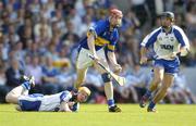 6 June 2004; John Devane, Tipperary, in action against Eoin Murphy, left, and James Murray, Waterford. Guinness Munster Senior Hurling Championship semi-final, Tipperary v Waterford, Pairc Ui Chaoimh, Cork. Picture credit; Brendan Moran / SPORTSFILE