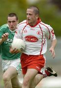 6 June 2004; Stephen O'Neill, Tyrone, in action against Niall Bogue, Fermanagh. Bank of Ireland Ulster Senior Football Championship, Tyrone v Fermanagh, St. Tighernach's Park, Clones, Co. Monaghan. Picture credit; Damien Eagers / SPORTSFILE