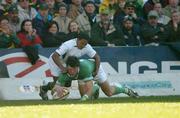 12 June 2004; Shane Horgan, Ireland, goes over for his try despite the tackle of  Breyton Taulse, South Africa. South Africa Tour June 2004, South Africa v Ireland, Vodacompark, Bloemfontein, Free State, South Africa. Picture credit; Matt Browne / SPORTSFILE