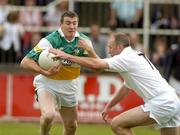 12 June 2004; Ciaran McManus, Offaly, is tackled by Glenn Ryan, Kildare. Bank of Ireland Football Championship Qualifier, Round 1, Kildare v Offaly, St. Conleth's Park, Newbridge, Co. Kildare. Picture credit; Brendan Moran / SPORTSFILE