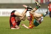 12 June 2004; Daniel Hughes, Down, in action against Paul Cashen, Carlow. Bank of Ireland Football Championship Qualifier, Round 1, Carlow v Down, Dr. Cullen Park, Carlow. Picture credit; Damien Eagers / SPORTSFILE
