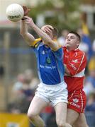 12 June 2004; Steven Cushe, Wicklow, in action against Eamon Burke, Derry. Bank of Ireland Football Championship Qualifier, Round 1, Wicklow v Derry, County Grounds, Aughrim, Co. Wicklow. Picture credit; David Maher / SPORTSFILE