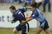 12 June 2004; Brian McConigle, London, is tackled by Dublin's Jason Sherlock. Bank of Ireland Football Championship Qualifier, Round 1, Dublin v London, Parnell Park, Dublin. Picture credit; Ray McManus / SPORTSFILE