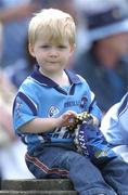 12 June 2004; A young Dublin supporter enjoys a packet of popcorn. Bank of Ireland Football Championship Qualifier, Round 1, Dublin v London, Parnell Park, Dublin. Picture credit; Ray McManus / SPORTSFILE