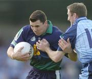12 June 2004; Fergus McMahon, London, is tackled by Dublin's Coman Goggins. Bank of Ireland Football Championship Qualifier, Round 1, Dublin v London, Parnell Park, Dublin. Picture credit; Ray McManus / SPORTSFILE