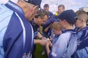 12 June 2004; Dublin manager Tommy Lyons signs a programme for a young supporter. Bank of Ireland Football Championship Qualifier, Round 1, Dublin v London, Parnell Park, Dublin. Picture credit; Ray McManus / SPORTSFILE