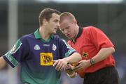 12 June 2004; Brian McConigle, London, is booked by referee Brian Tyrrell. Bank of Ireland Football Championship Qualifier, Round 1, Dublin v London, Parnell Park, Dublin. Picture credit; Ray McManus / SPORTSFILE
