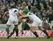 12 June 2004; Paul O'Connell, Ireland, is tackled by Gerrie Britz, 7, and Victor Matfield, South Africa. South Africa Tour June 2004, South Africa v Ireland, Vodacompark, Bloemfontein, Free State, South Africa. Picture credit; Matt Browne / SPORTSFILE