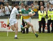 12 June 2004; Ciaran McManus, Offaly, in action against Eamonn Callaghan, Kildare. Bank of Ireland Football Championship Qualifier, Round 1, Kildare v Offaly, St. Conleth's Park, Newbridge, Co. Kildare. Picture credit; Brendan Moran / SPORTSFILE
