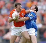 13 June 2004; Aidan O'Rourke, Armagh, in action against Larry Reilly, Cavan. Bank of Ireland Ulster Senior Football Championship Semi-Final, Cavan v Armagh, St. Tighernach's Park, Clones, Co. Monaghan. Picture credit; Damien Eagers / SPORTSFILE