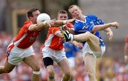 13 June 2004; Jason O'Reilly, Cavan, has his shoot blocked down by Armagh's Enda McNulty, left,supported by teammate John Toal. Bank of Ireland Ulster Senior Football Championship Semi-Final, Cavan v Armagh, St. Tighernach's Park, Clones, Co. Monaghan. Picture credit; Damien Eagers / SPORTSFILE