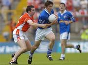 13 June 2004; Anthony Gaynor, Cavan, is tackled by Oisin McConville, Armagh. Bank of Ireland Ulster Senior Football Championship Semi-Final, Cavan v Armagh, St. Tighernach's Park, Clones, Co. Monaghan. Picture credit; Damien Eagers / SPORTSFILE