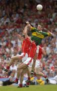 13 June 2004; Darragh O'Se, Kerry, in action against Martin Cronin, left, and Dermot Hurley, Cork. Bank of Ireland Munster Senior Football Championship Semi-Final, Kerry v Cork, Fitzgerald Stadium, Killarney, Co. Kerry. Picture credit; Brendan Moran / SPORTSFILE