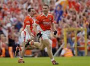 13 June 2004; Diarmuid Marsden, Armagh, celebrates with team-mate Martin O'Rourke after putting his team one point ahead. Bank of Ireland Ulster Senior Football Championship Semi-Final, Cavan v Armagh, St. Tighernach's Park, Clones, Co. Monaghan. Picture credit; Damien Eagers / SPORTSFILE