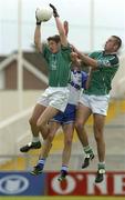 13 June 2004; Limerick's Padraig Browne, supported by team-mate John Galvin, right, wins possession against John Coffee, Waterford. Bank of Ireland Munster Senior Football Championship Semi-Final, Limerick v Waterford, Gaelic Grounds, Limerick. Picture credit; Pat Murphy / SPORTSFILE
