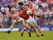 13 June 2004; Paddy McKeever, Armagh, in action against Anthony Gaynor, Cavan, supported by team-mate Diarmuid Marsden. Bank of Ireland Ulster Senior Football Championship Semi-Final, Cavan v Armagh, St. Tighernach's Park, Clones, Co. Monaghan. Picture credit; Damien Eagers / SPORTSFILE