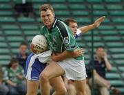 13 June 2004; Mike O'Brien, Limerick, is tackled by Conan Watt, Waterford. Bank of Ireland Munster Senior Football Championship Semi-Final, Limerick v Waterford, Gaelic Grounds, Limerick. Picture credit; Pat Murphy / SPORTSFILE