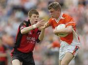 13 June 2004; Eoin Rafferty, Armagh, in action against Luke Howard, Down. Ulster Minor Football Championship Semi-Final, Down v Armagh, St. Tighernach's Park, Clones, Co. Monaghan. Picture credit; Damien Eagers / SPORTSFILE