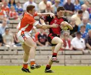 13 June 2004; Stephen Doran, Down, in action against Charlie Vernon. Armagh. Ulster Minor Football Championship Semi-Final, Down v Armagh, St. Tighernach's Park, Clones, Co. Monaghan. Picture credit; Damien Eagers / SPORTSFILE